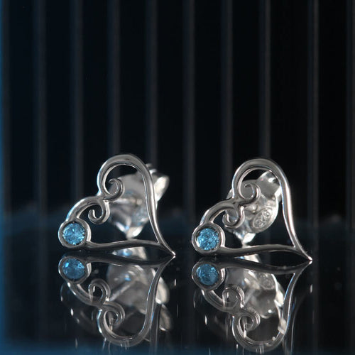 Aqua Kokoro stud earrings in sterling silver with heart shape and natural aquamarine detail
