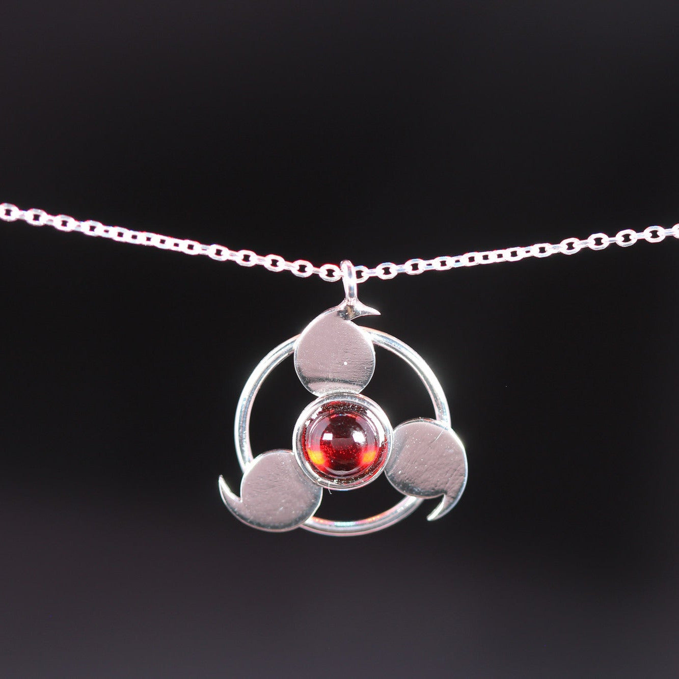 Sterling silver awakened eye necklace with garnet