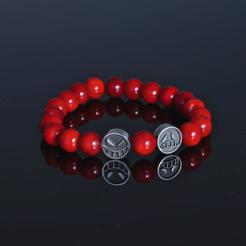 En bracelet in sterling silver with oxidized faces and natural red tourmaline beads