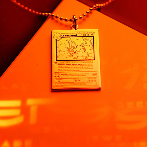 Engraved flame card detail in sterling silver with intricate symbols