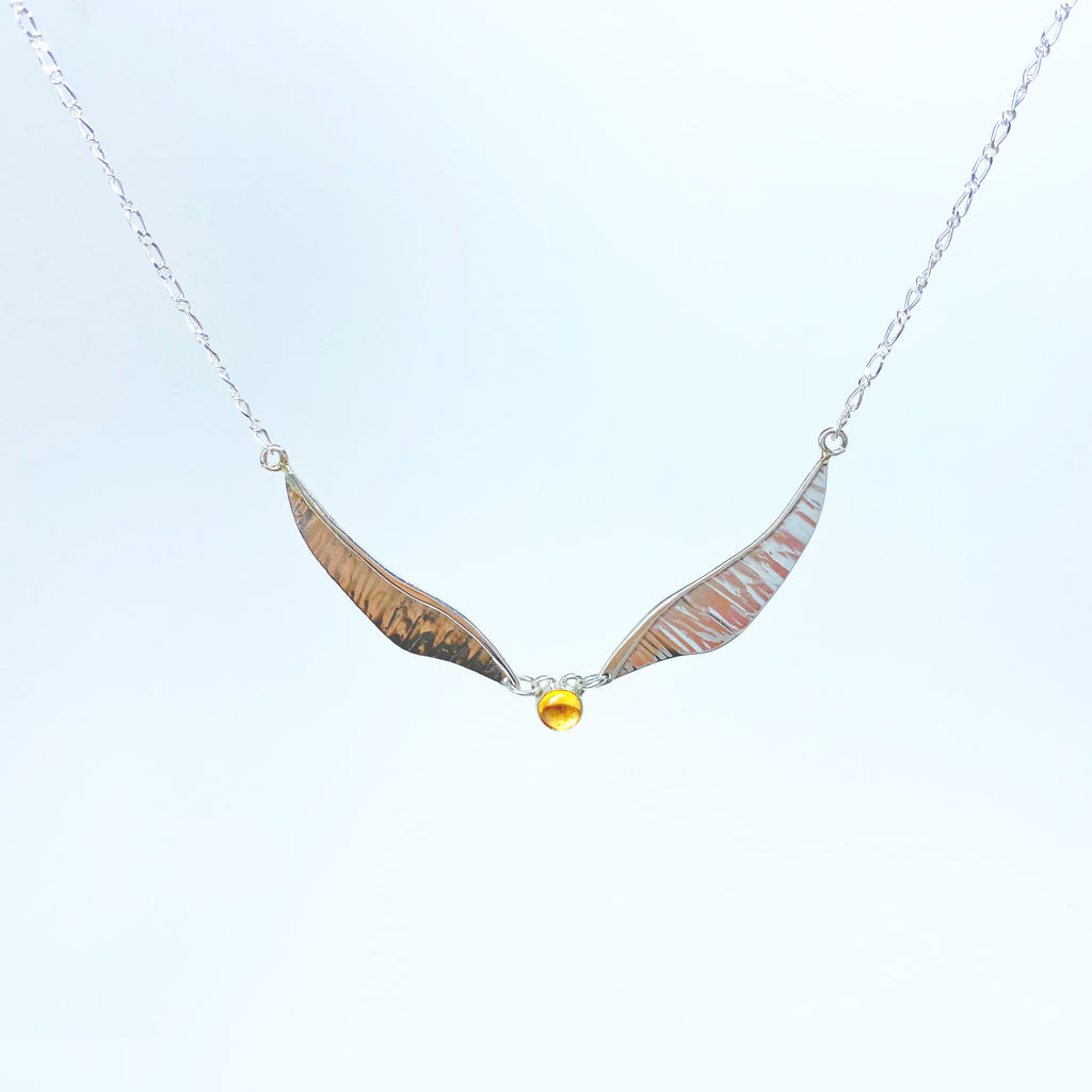 Golden wing necklace with citrine and sterling silver wings