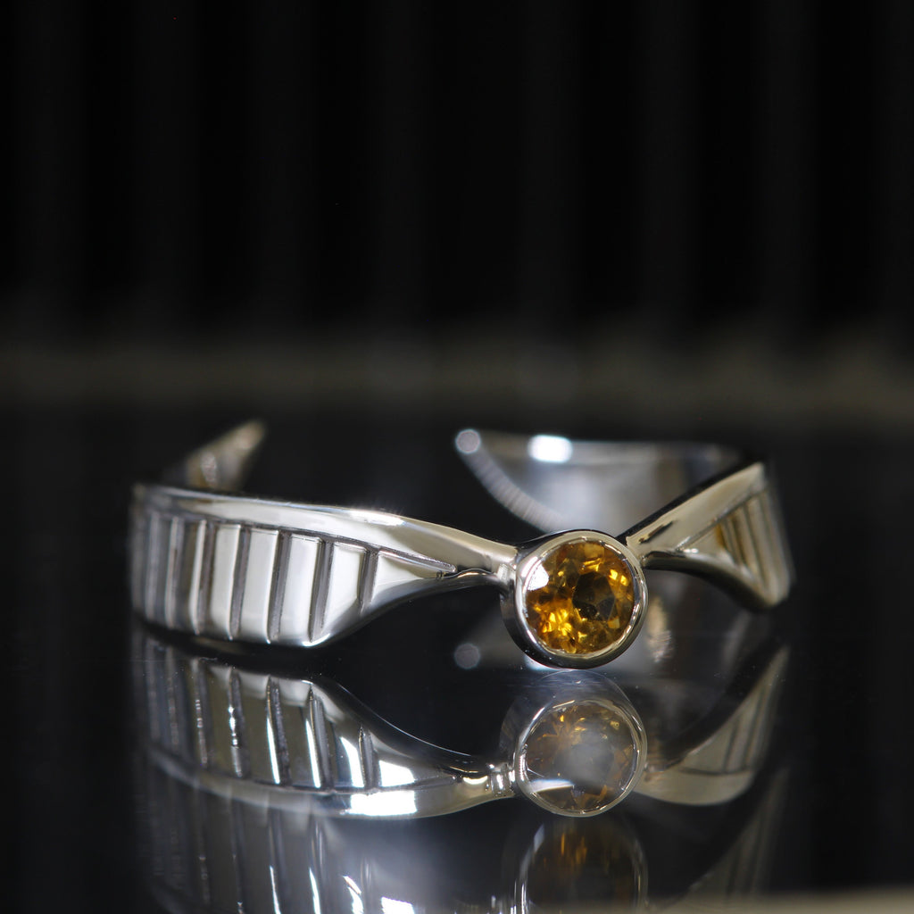 Golden Wing ring in sterling silver with gold zirconia and wing-shaped design