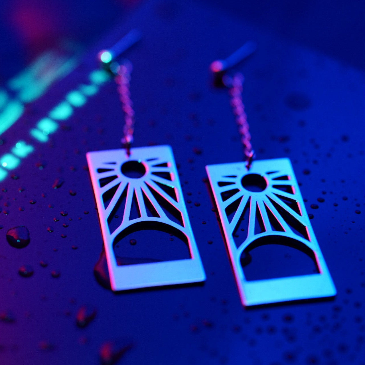 Detail of Hanafuda earrings showing chain and engraved shapes in sterling silver