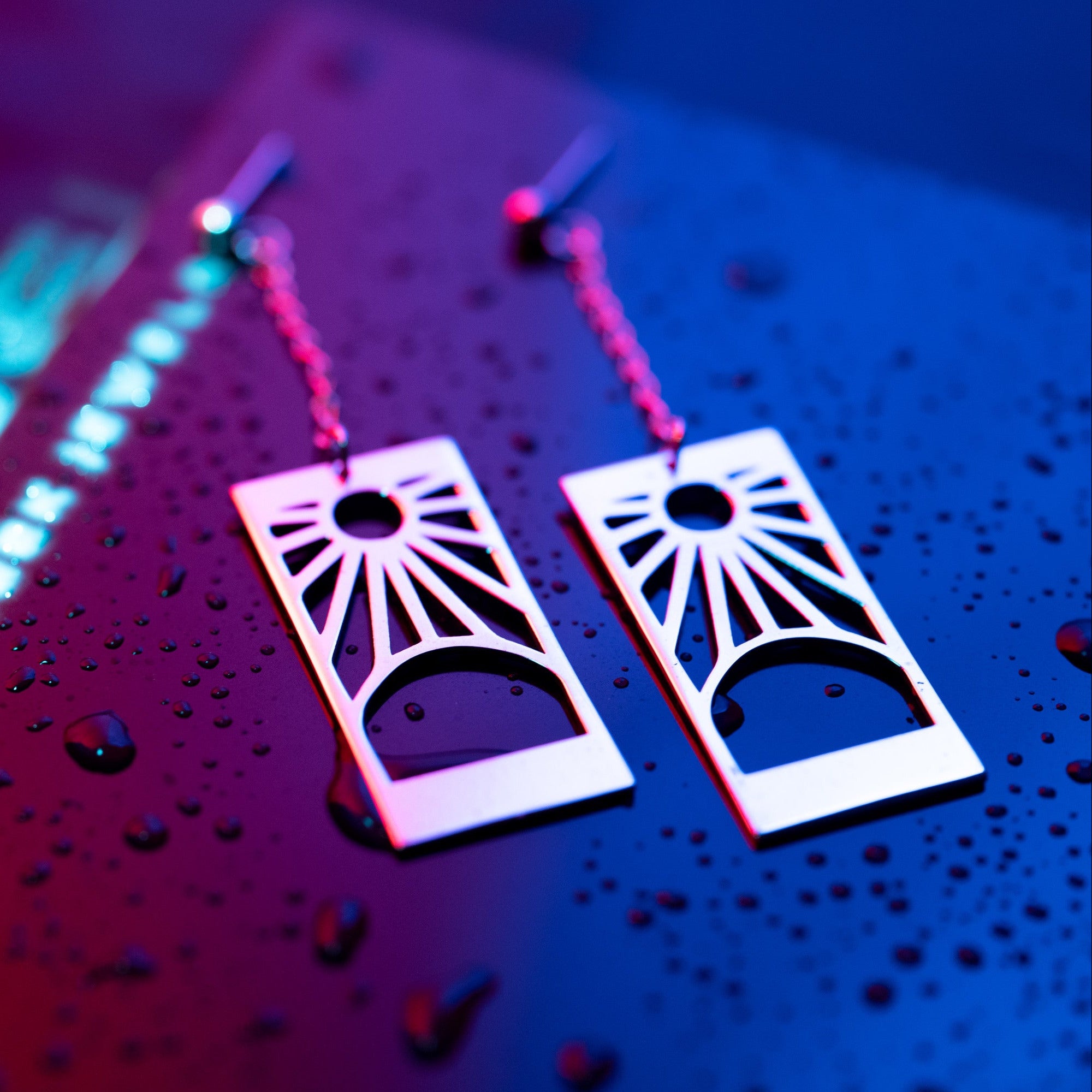 Full view of Hanafuda earrings in sterling silver with chain and refined silhouette