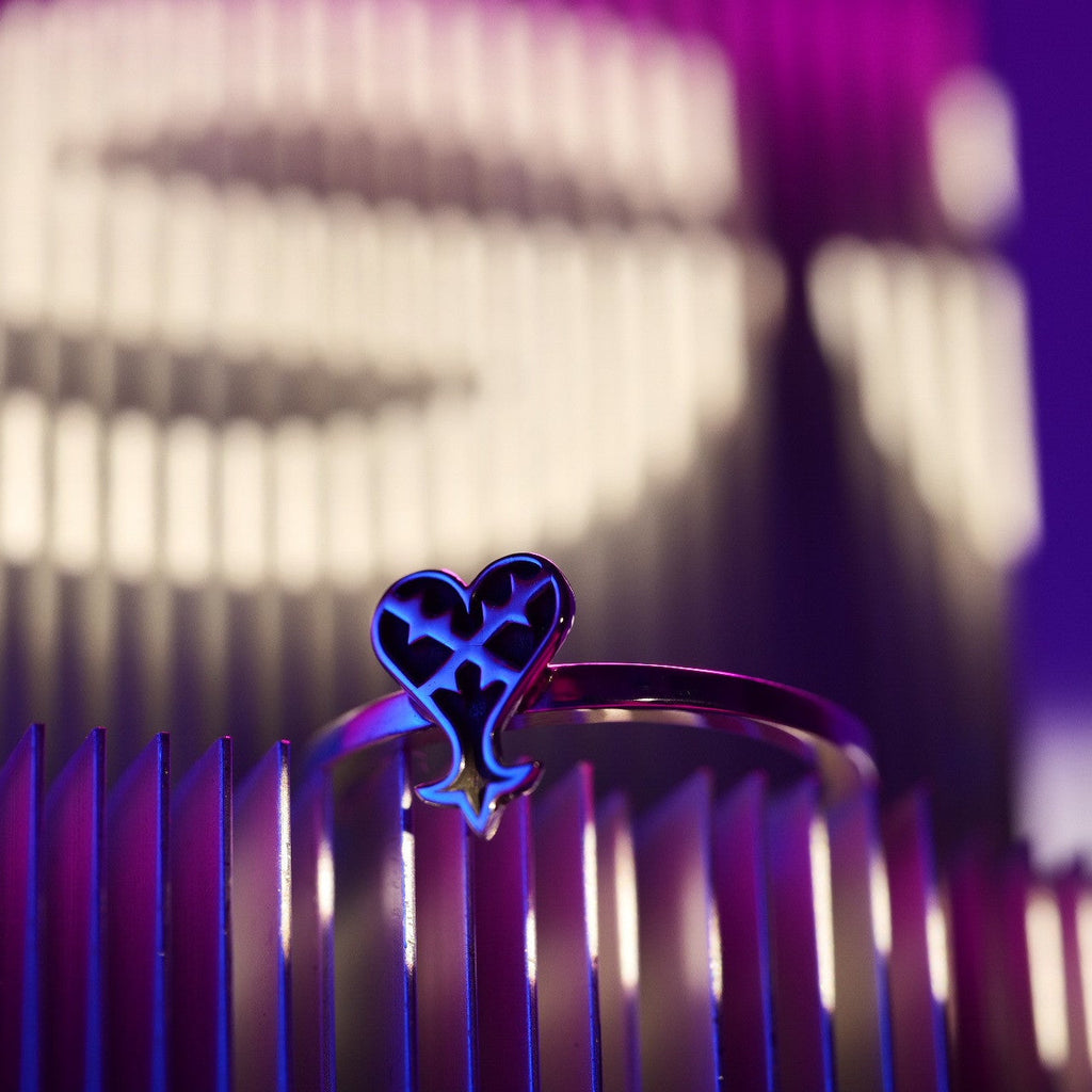 Full view of Kage ring in sterling silver with inverted heart symbol