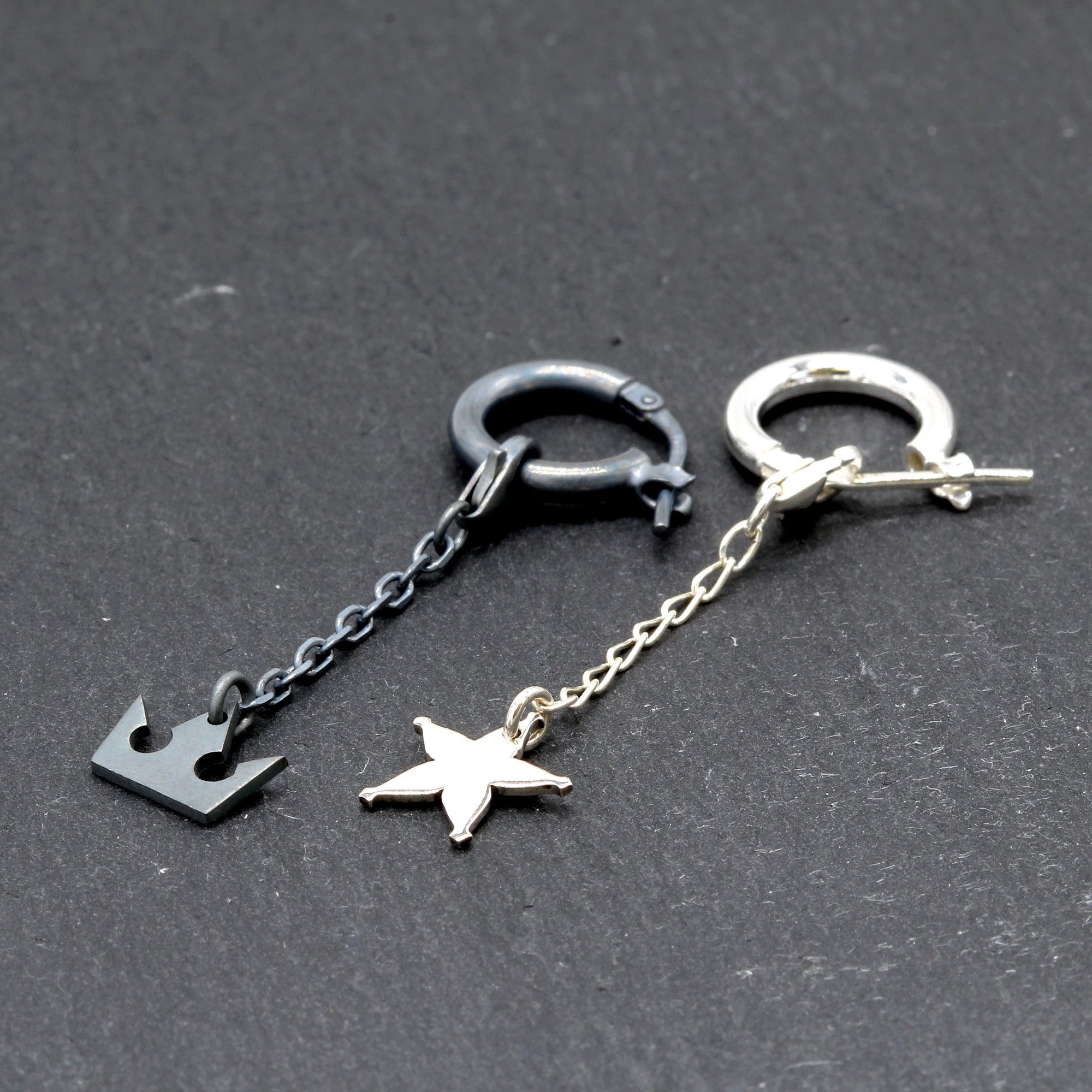 Kizuna earrings in sterling silver with crown and star charms representing memory and promise