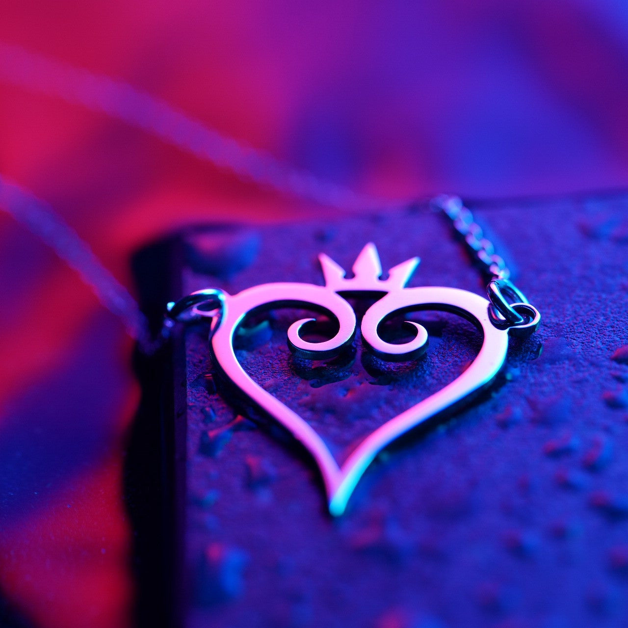 Side view of silver heart necklace