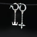 Korona chain earrings in sterling silver with crown and cross symbols connected by a delicate chain