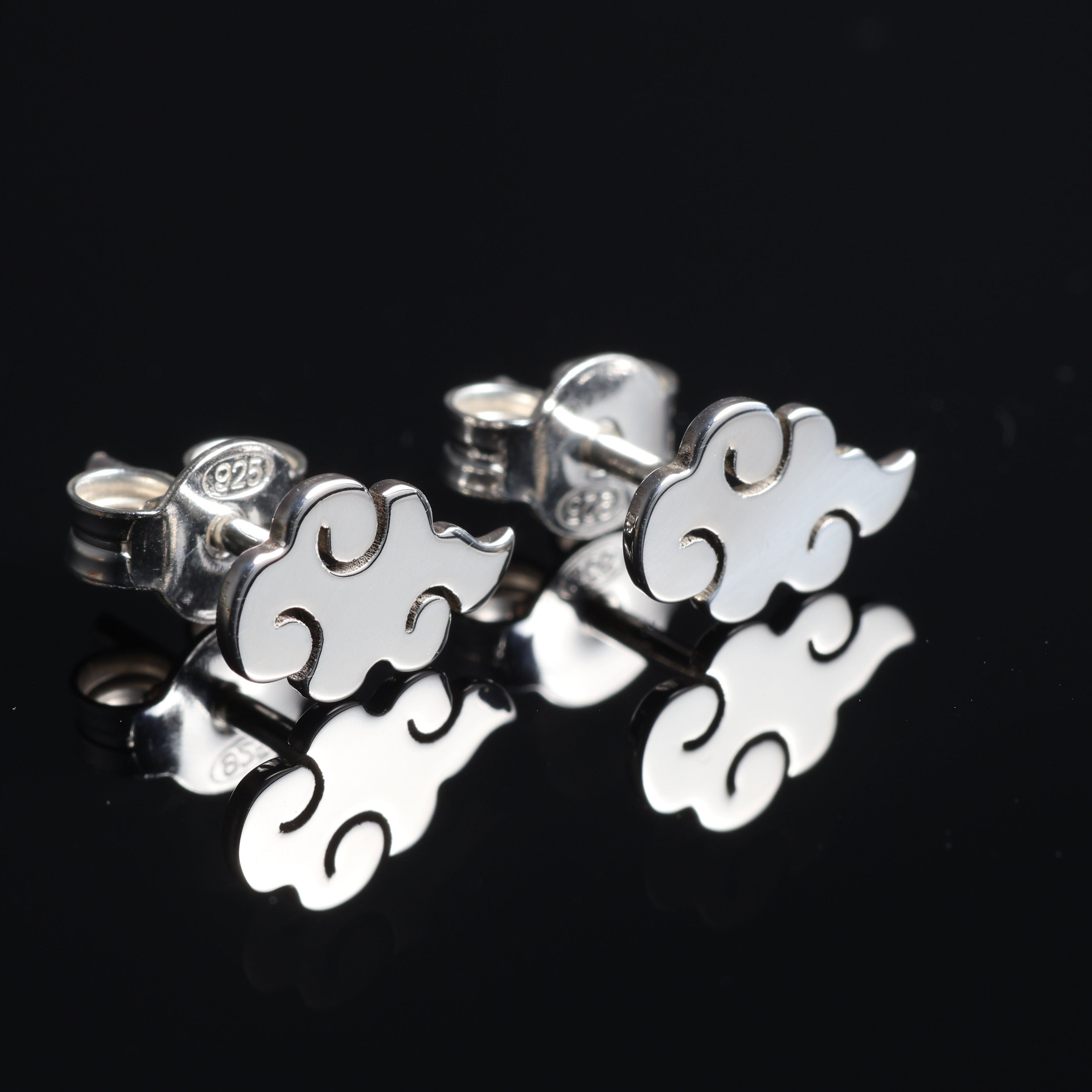 Kumo earrings worn, showing subtle and minimal cloud design