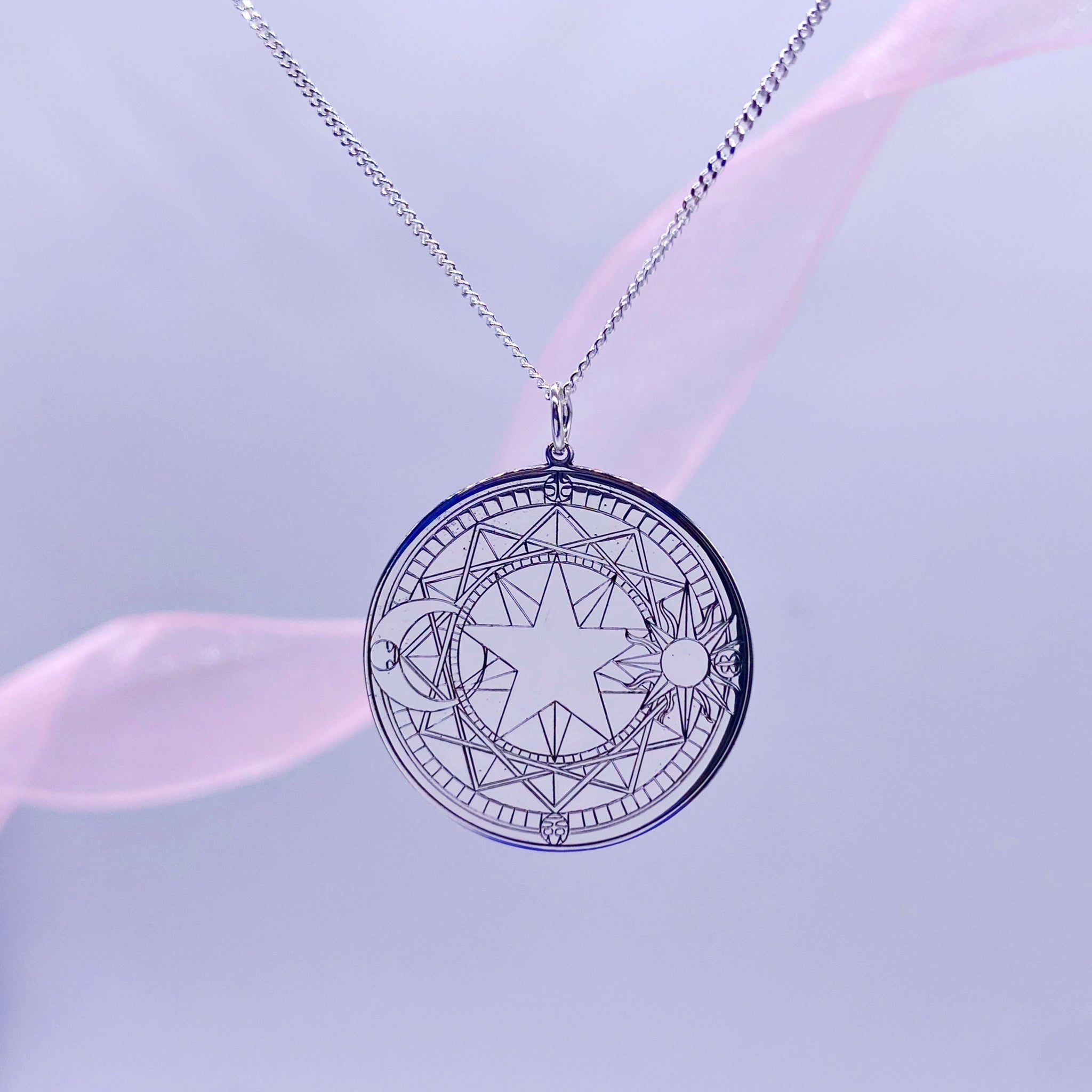 Detail of engraved magical circle in sterling silver