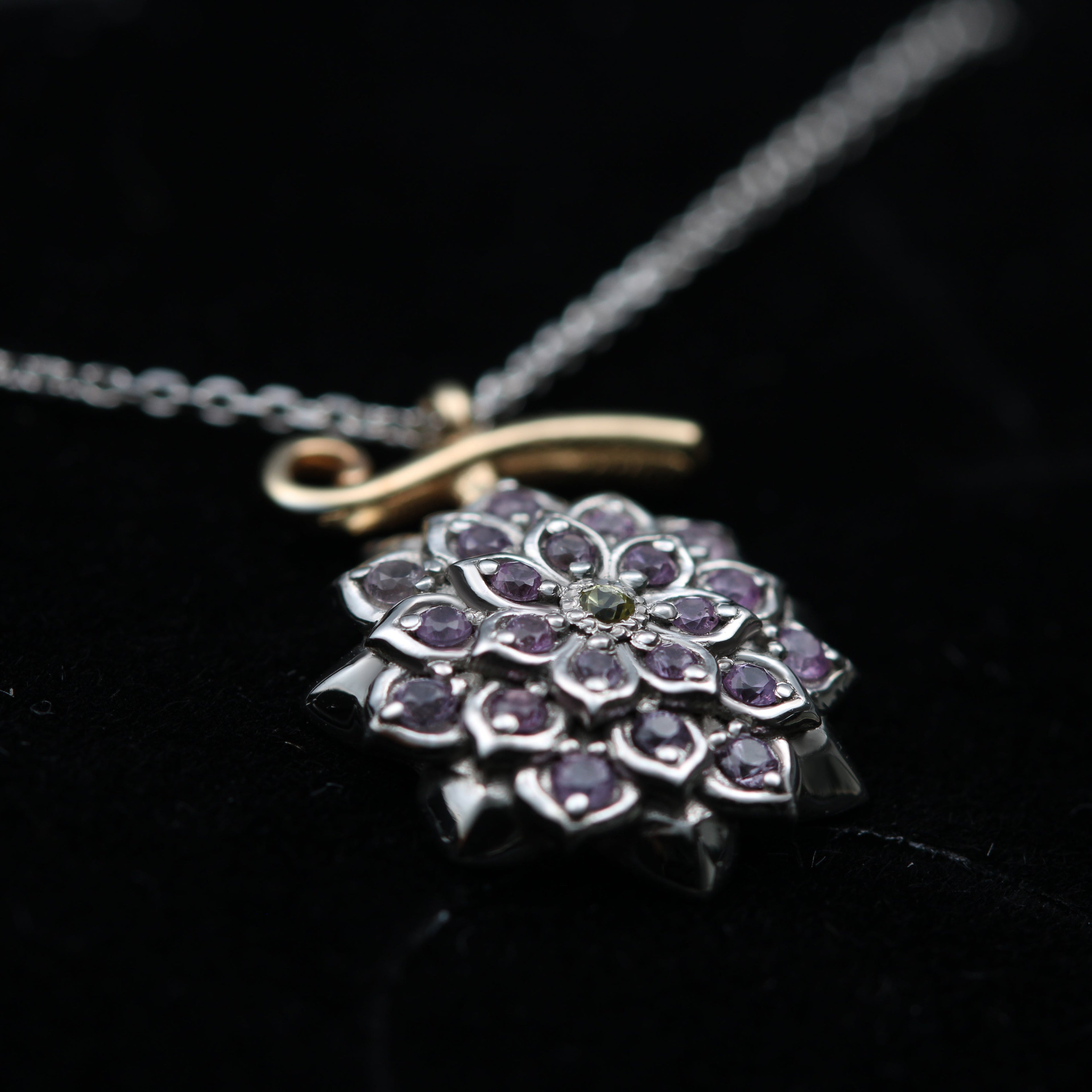 Detail of lilac and yellow sapphires in flower necklace