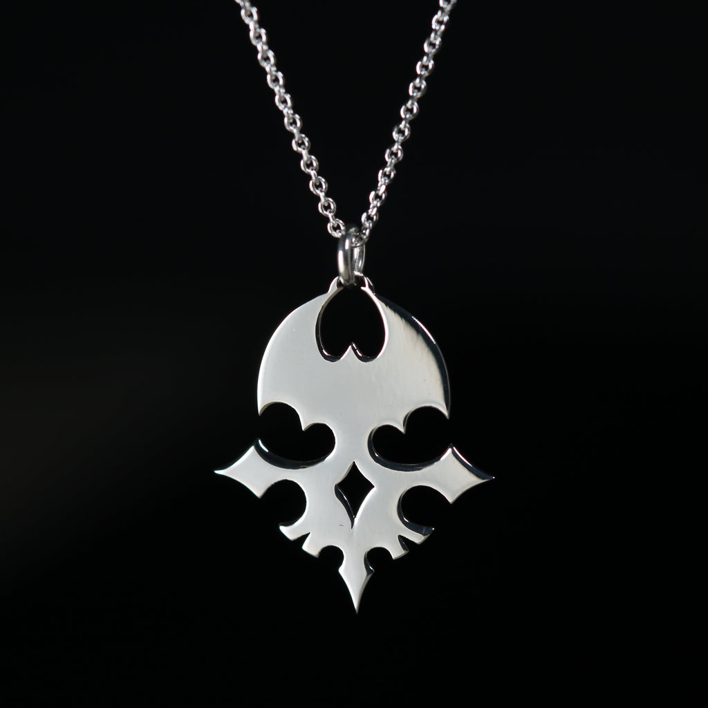 Detail of the sterling silver player pin and emblem necklace