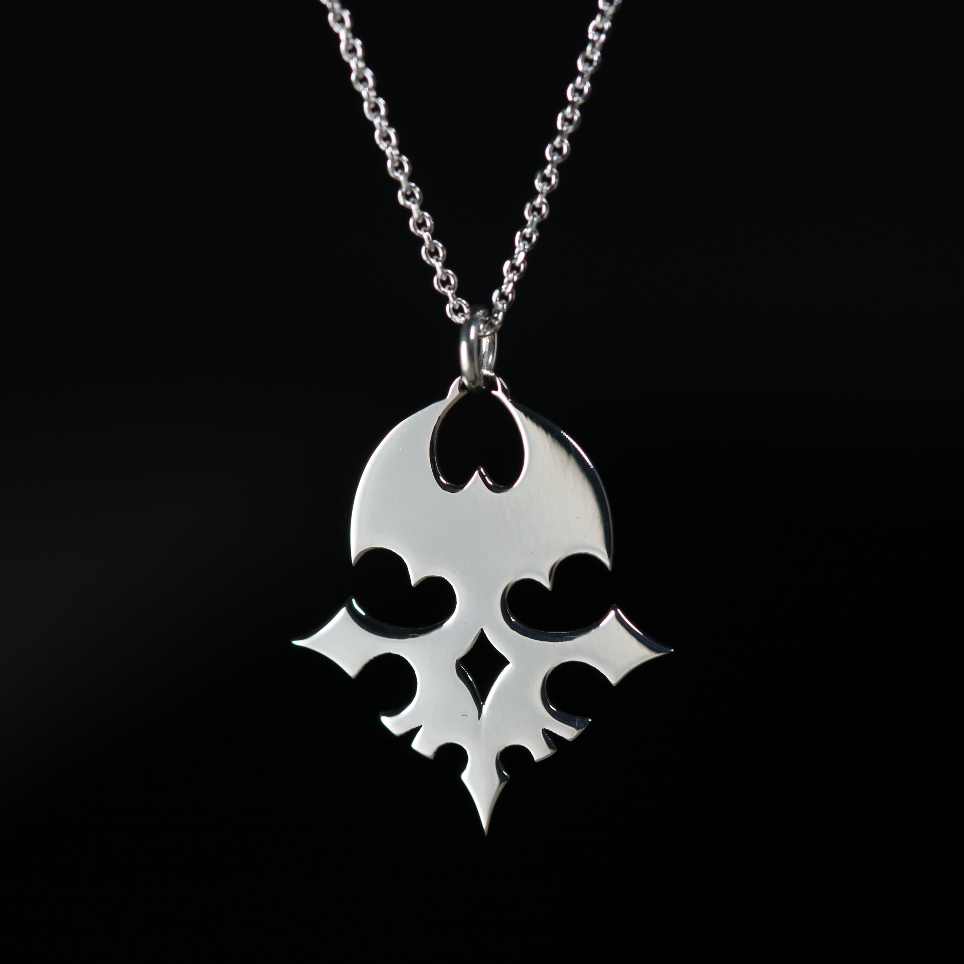 Detail of the sterling silver player pin and emblem necklace