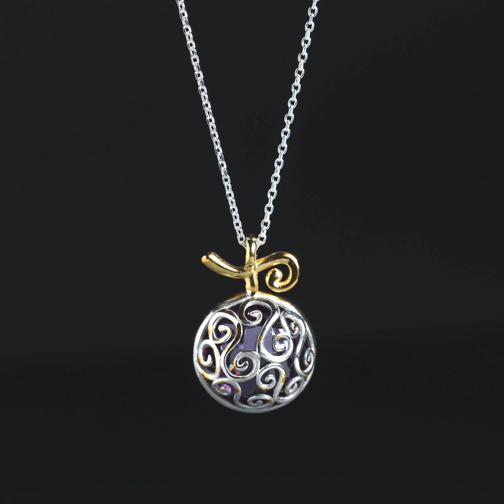 Detail of purple cubic zirconia in fruit necklace