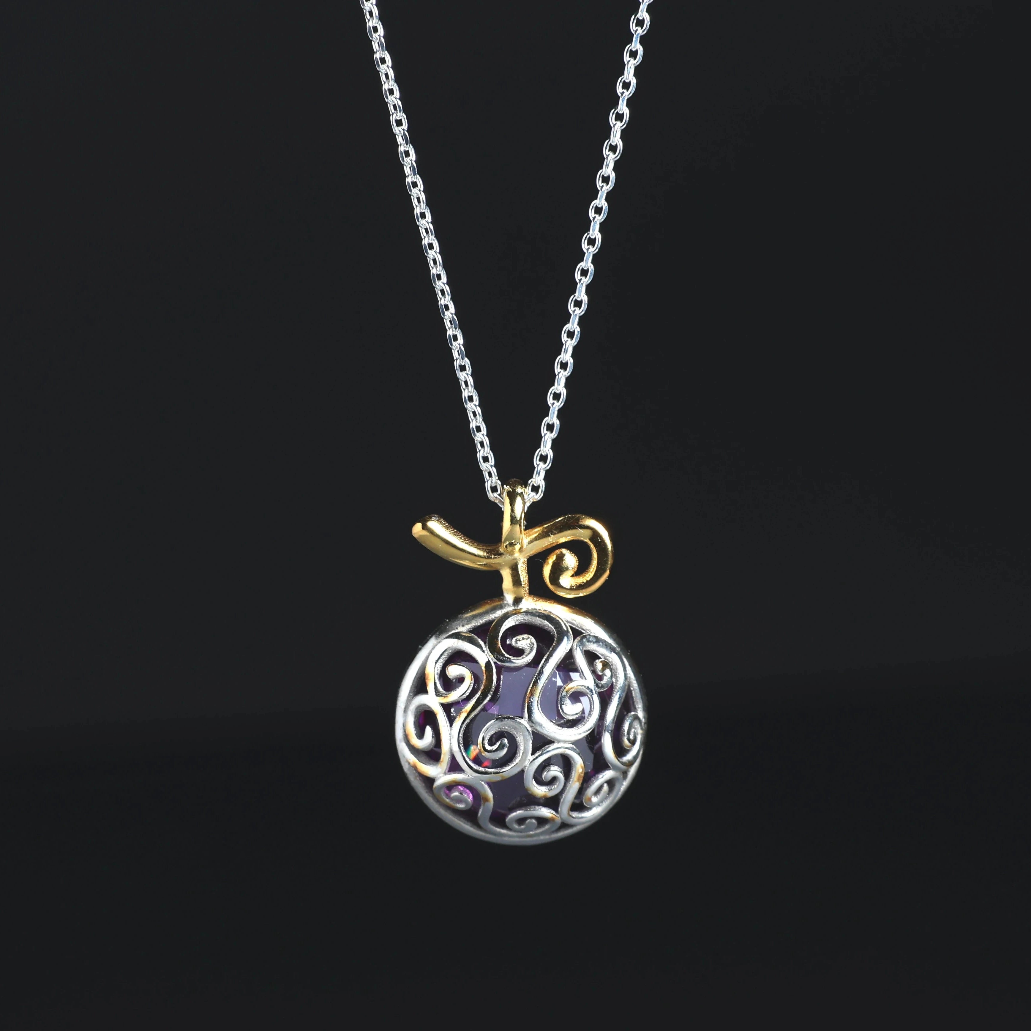 Detail of purple cubic zirconia in fruit necklace