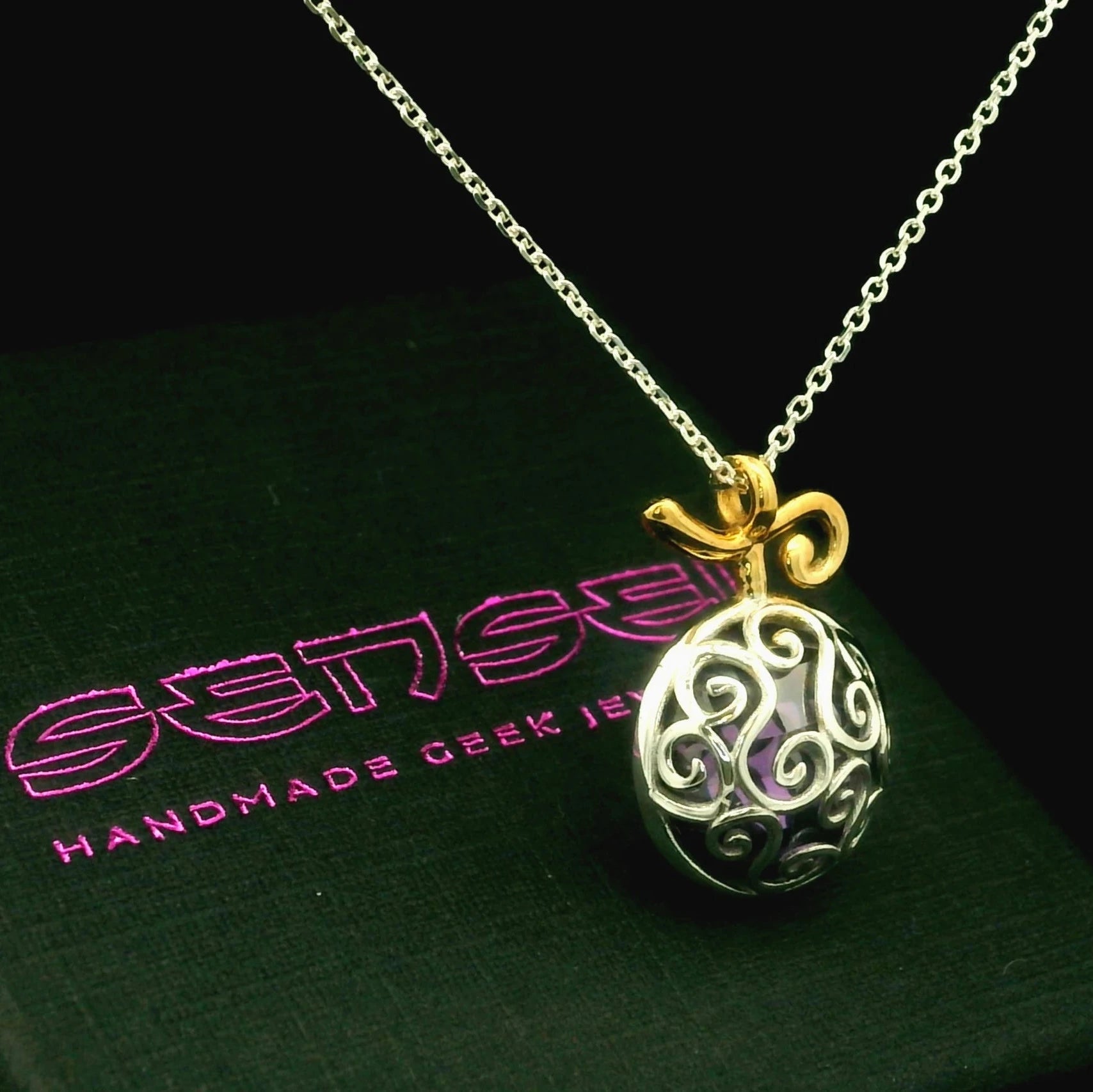 Side view of purple fruit necklace