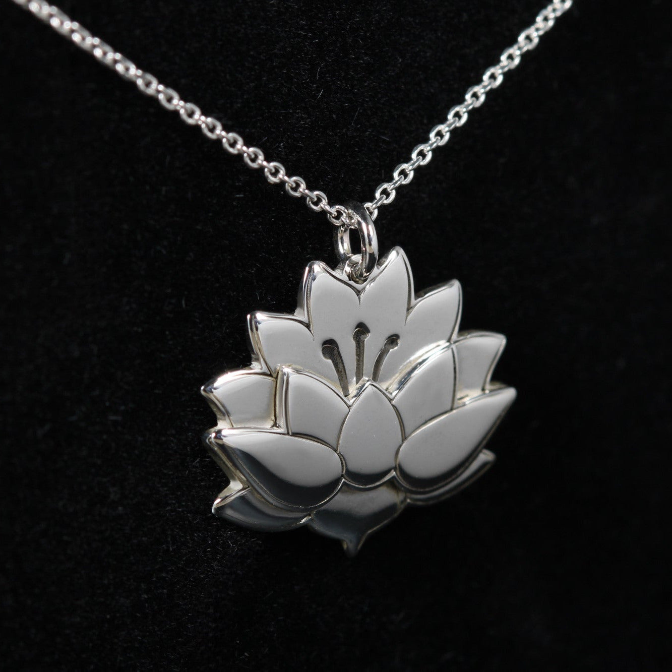 Detail of lotus flower pendant in sterling silver