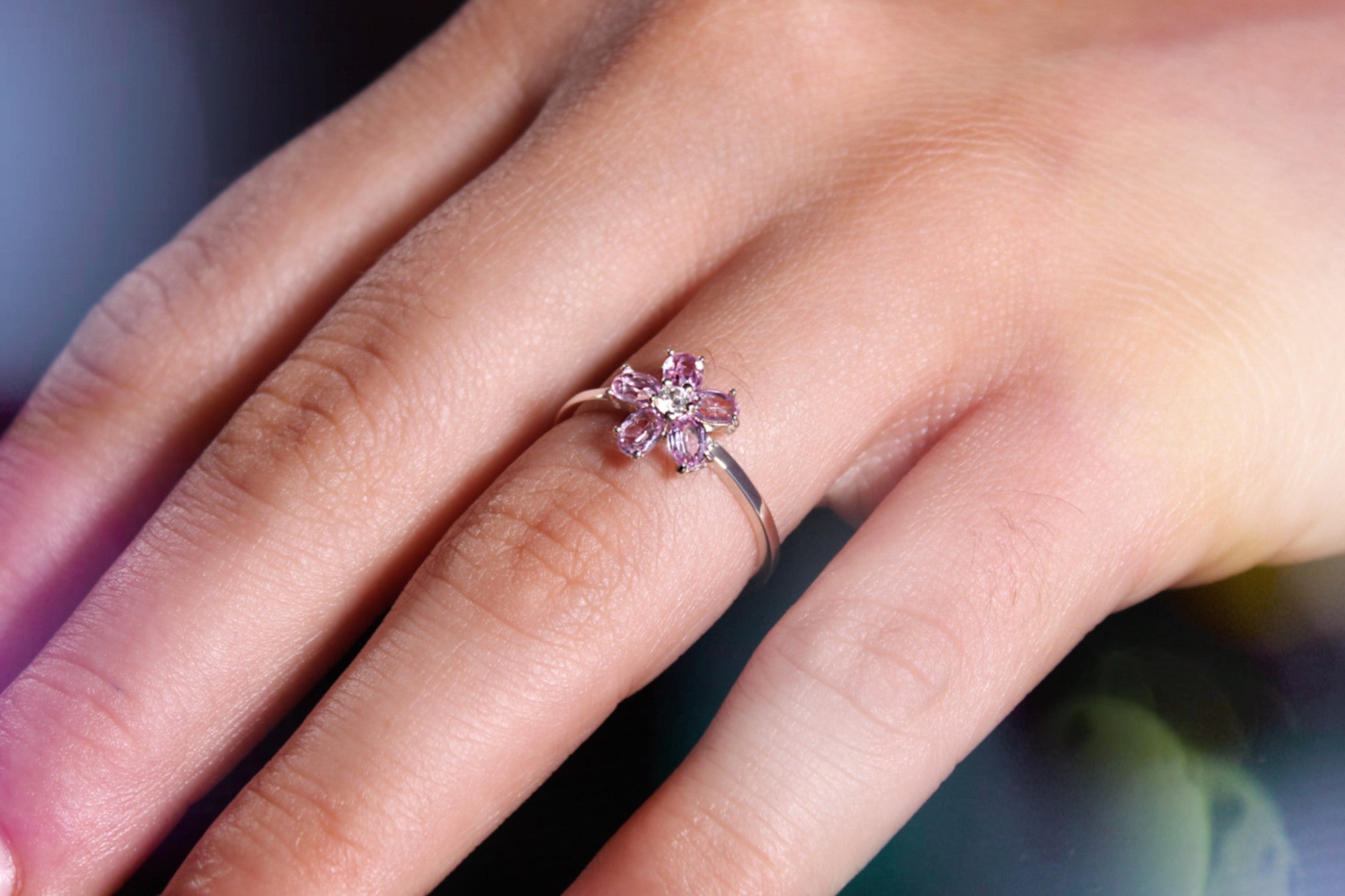 Sakura ring worn, showing delicate floral design on hand