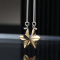 Shared destiny necklace with two interlocking halves in sterling silver and gold