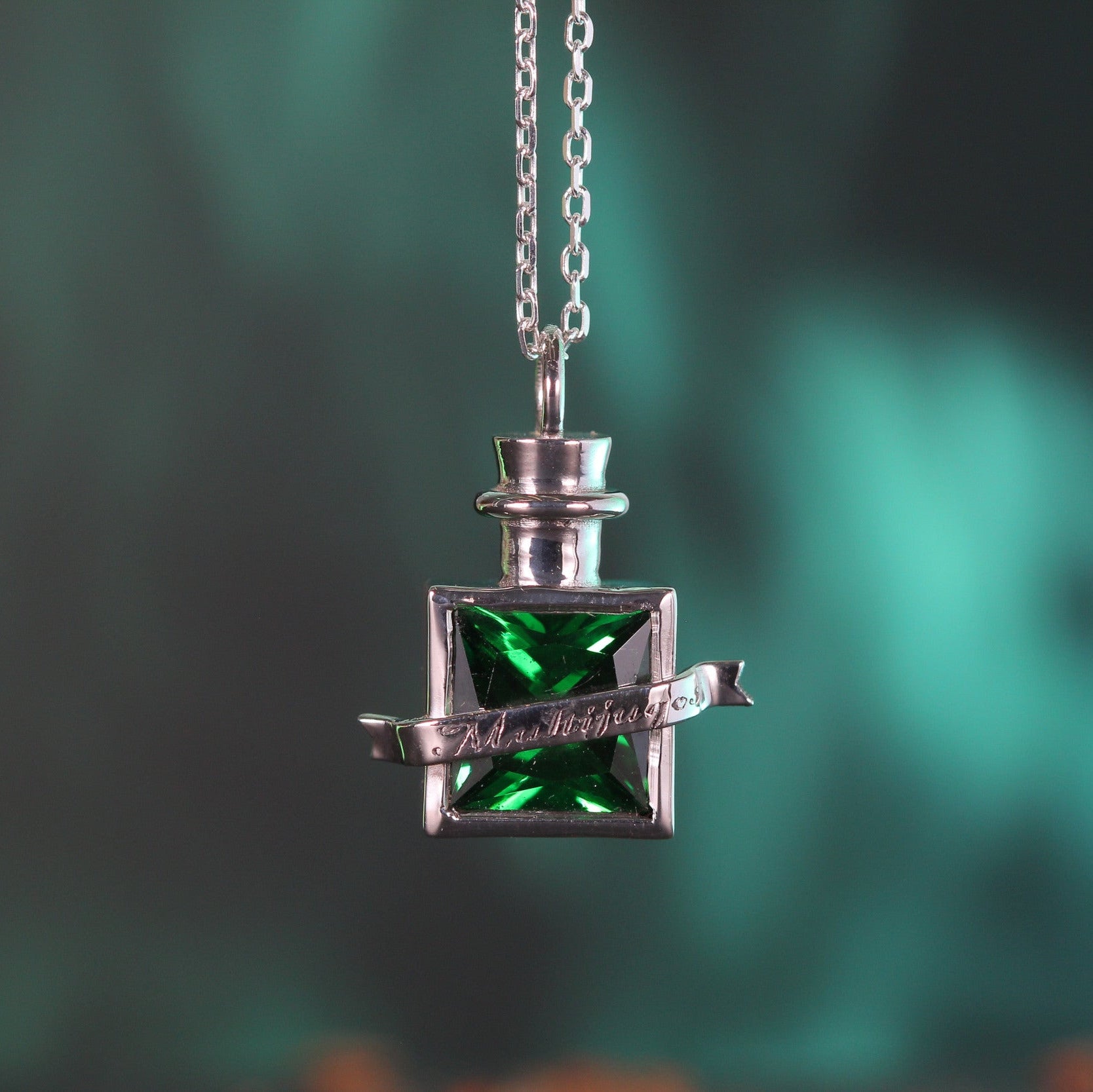 Detailed view of potion pendant and chain