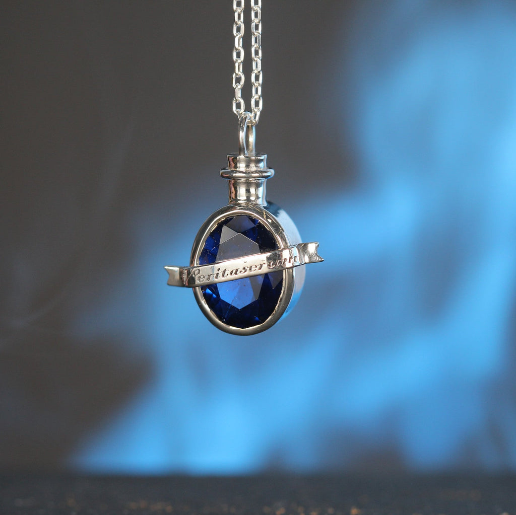 Close-up of truth elixir pendant with blue stone