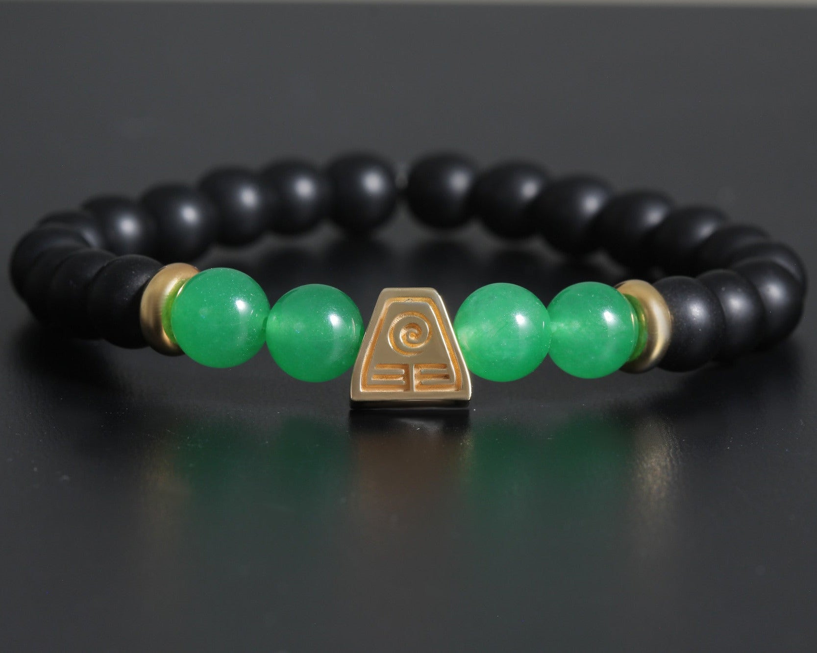 Tsuchi bracelet in sterling silver with gold plated earth symbol, black onyx and green agate beads