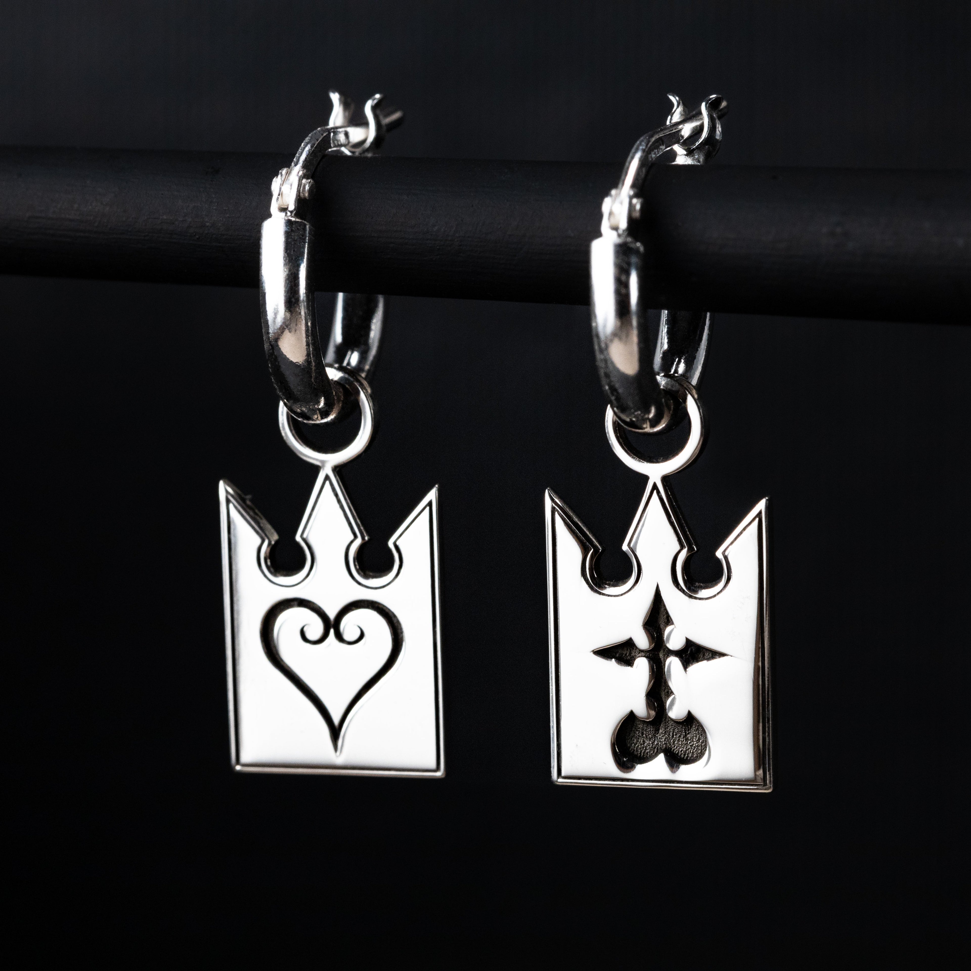 Unmei earrings in sterling silver with card design featuring heart and incorporeal symbol