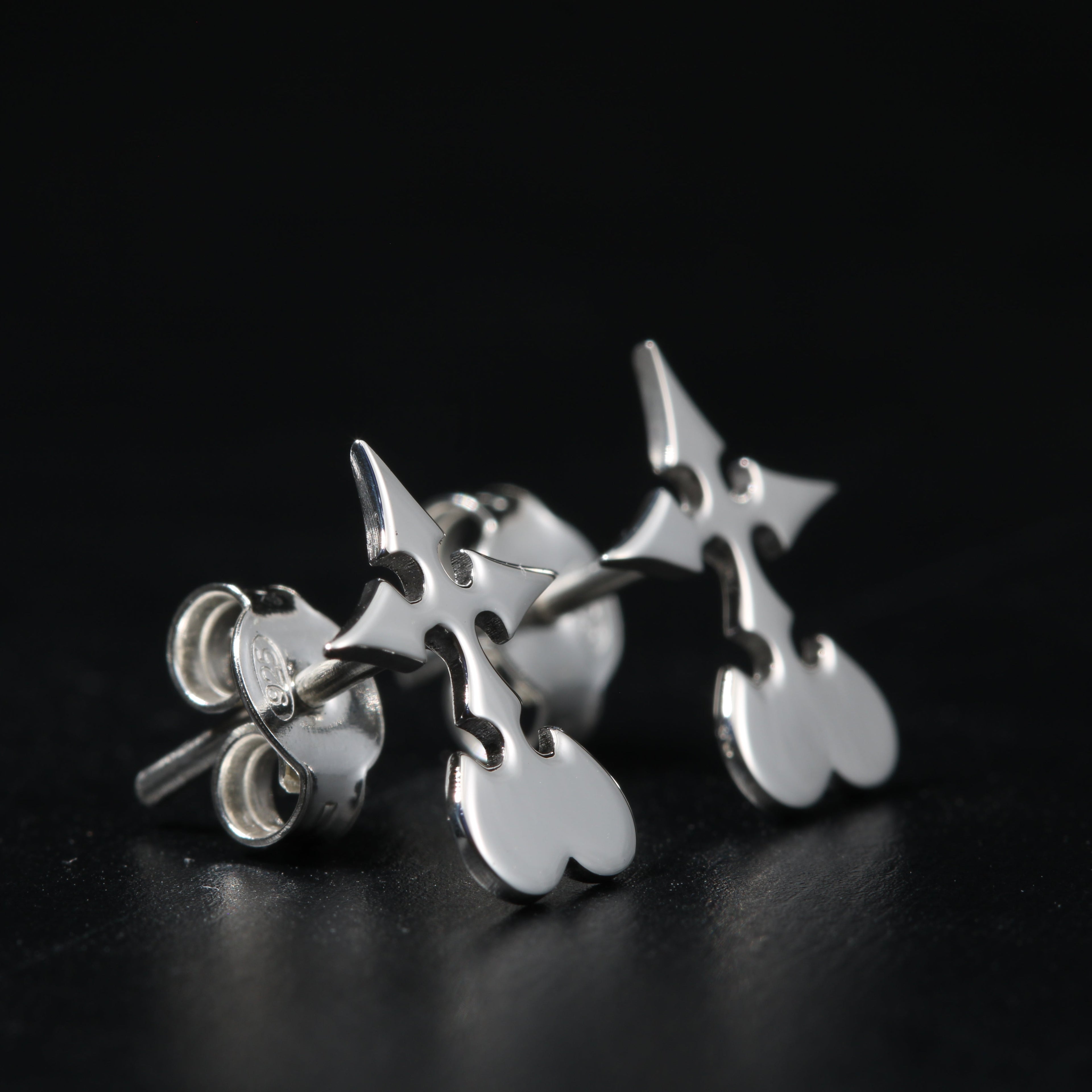 Utsuro stud earrings worn, showing subtle and elegant everyday design