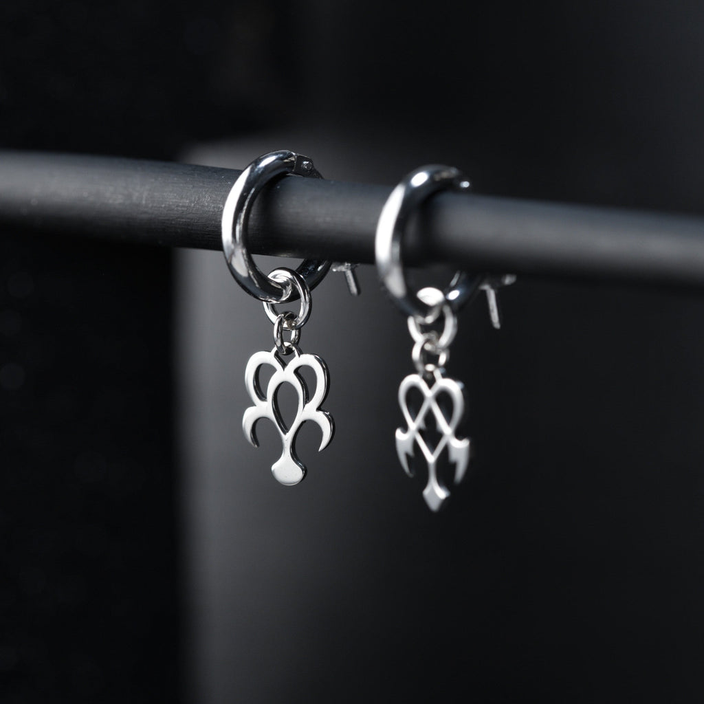 Yume hoop earrings worn, showing balanced and expressive dream and nightmare design