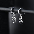 Yume hoop earrings worn, showing balanced and expressive dream and nightmare design
